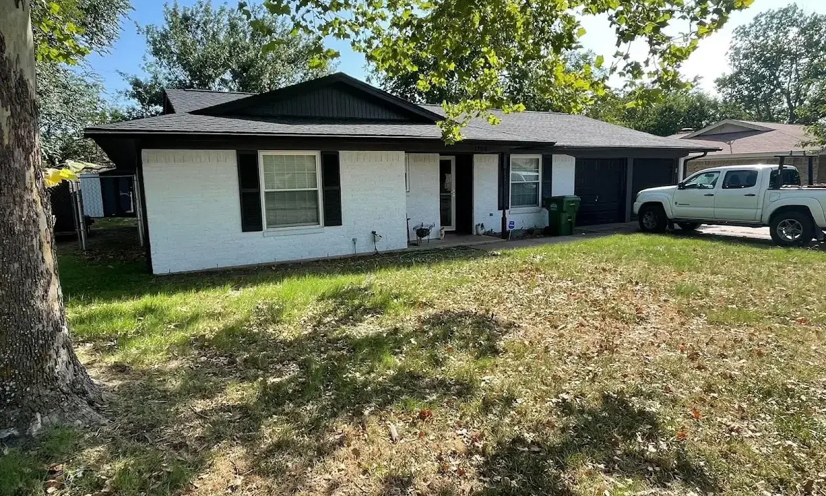 Professional roofing crew working on a residential roof in Merrimack